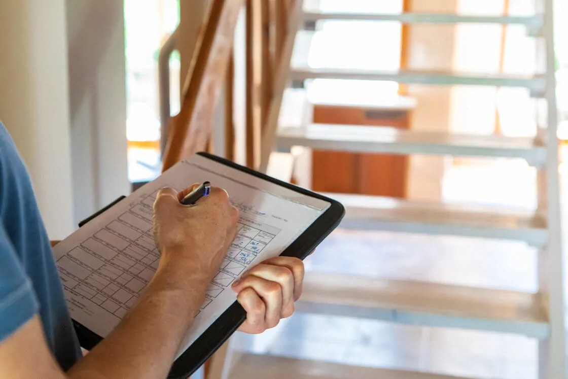 A Man Holding a Checklist for Indoor Air Quality Testing