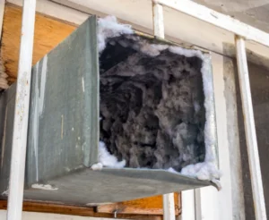 Air duct filled with heavy dust and debris before Duct Cleaning Phoenix service